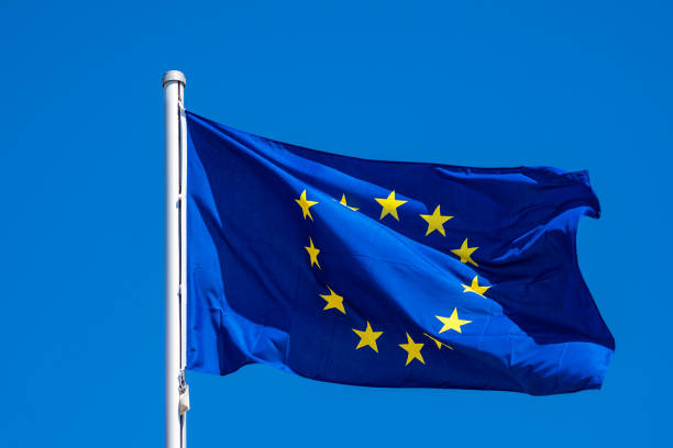 Flag of Europe with blue sky in Warnemuende, Germany Flag of Europe with blue sky in Warnemuende, Germany. rostock photos stock pictures, royalty-free photos & images