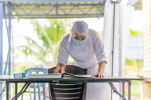 istock Female frontliner performing her tasks during the coronavirus pandemic. 1290473469