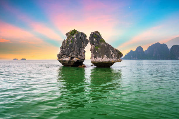 Dreamy sunset among the rocks of Halong Bay, Vietnam Dreamy sunset among the rocks of Halong Bay, Vietnam, This is the UNESCO World Heritage Site, it is a beautiful natural wonder in northern Vietnam haiphong province photos stock pictures, royalty-free photos & images