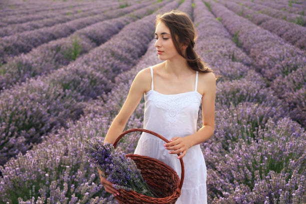 istock Young girl in lavender field 1290474724