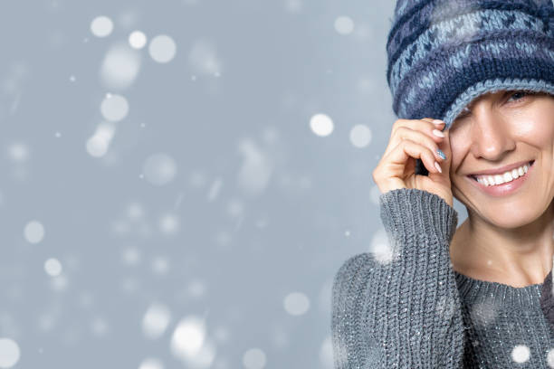 istock Smiling woman taking selfie in snow 1290474776