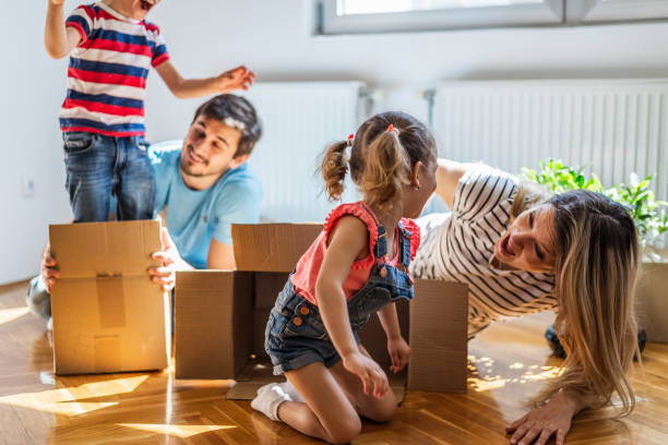 istock Playful family into new home 1290475021