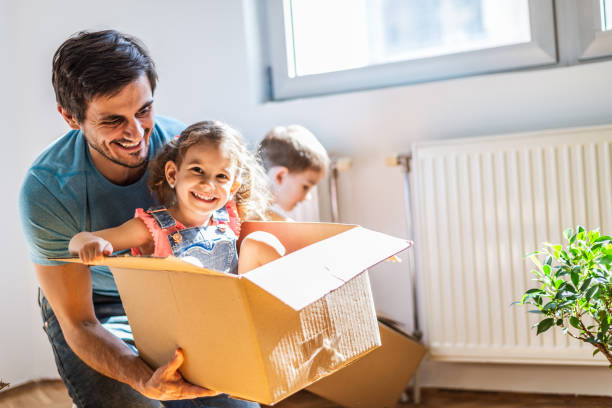 istock Playful family into new home 1290475053