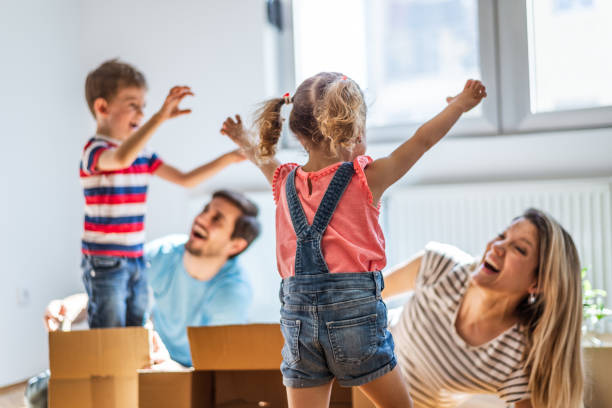istock Playful family into new home 1290475142