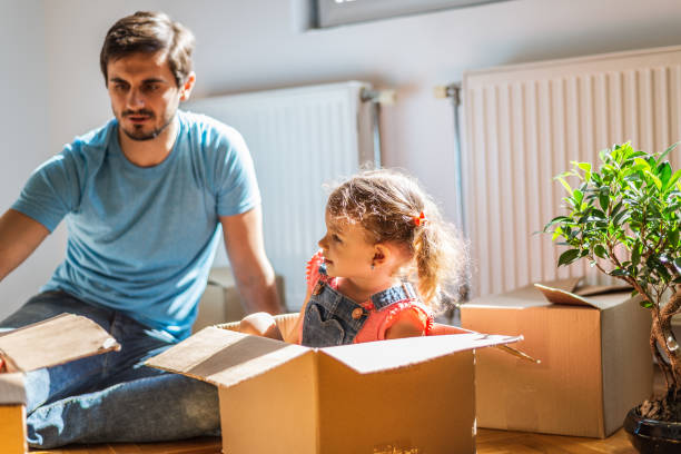 istock Playful family into new home 1290475238