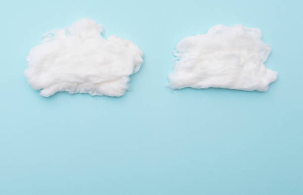 istock Cumulus clouds by cotton wool on blue surface, layout for ideas, space for text 1290477346