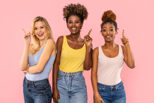 istock Three beautiful multiethnic women smiling and looking at camera. 1290477858