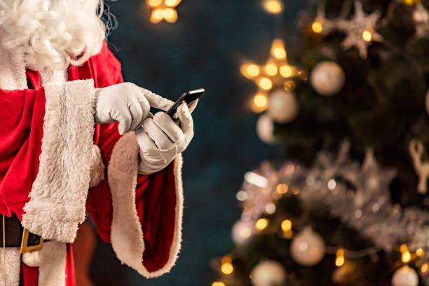 istock Santa Claus touching a smartphone at Christmas 1290479983