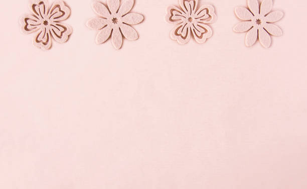 istock Decorative soft flowers made of felt. Creative background for Easter, Mother's day, happy birthday greeting cards 1290480428