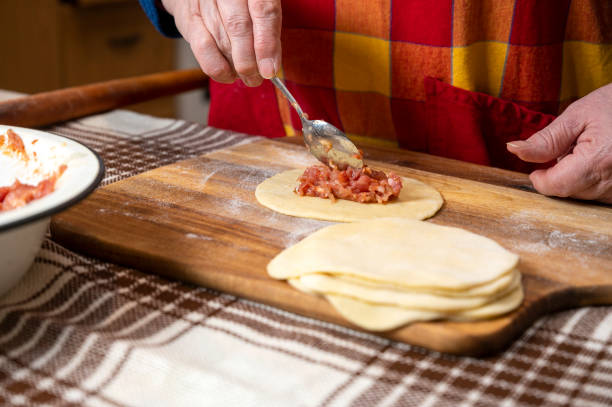 istock Woman making  manti  with minced beef meat 1290482503