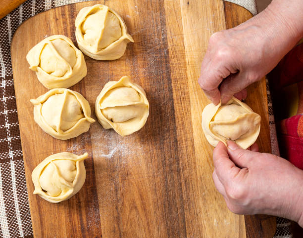 istock Woman making  manti  with minced beef meat 1290482685
