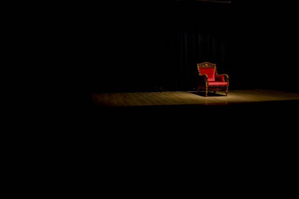 Antique wooden seat with red cushion