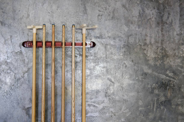 billiard cue sticks hang on wall billiard cue sticks hanging on wall pool cue stock pictures, royalty-free photos & images