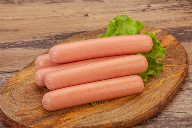 istock Tasty meat sausages over board 1290485280