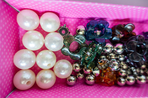 Woman fashion accessories, pearls and hairpins.