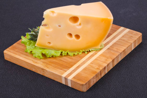istock Maasdam cheese  in the board served salad leaves 1290487055