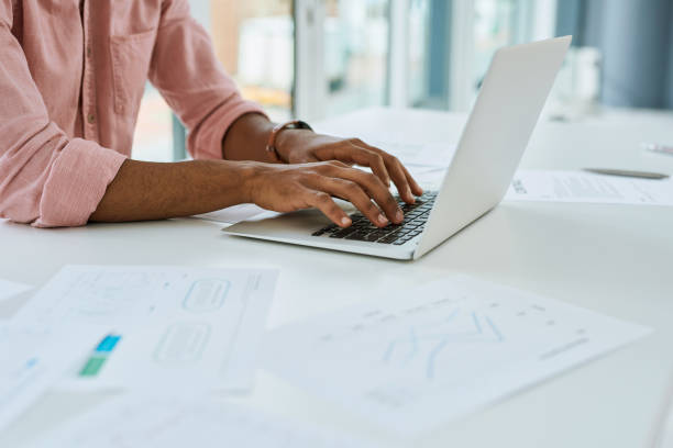 istock Typing up the last of his reports for the day 1290488069