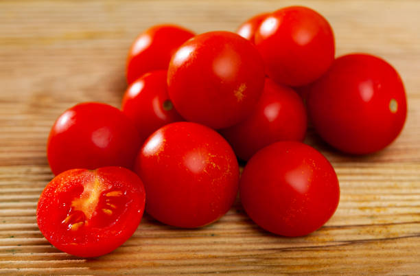istock Fresh organic cherry tomatoes on wooden table 1290488470