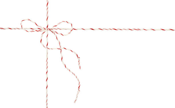 istock White and red Christmas wrapping ropes tied in bow for gift box isolated on white 1290489352