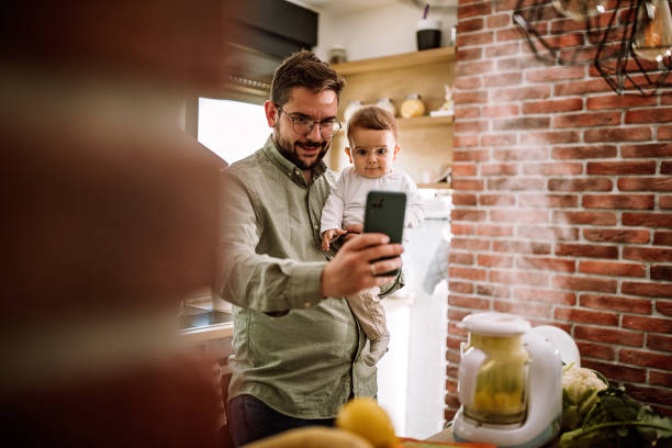 istock Father enjoying to make food for his son 1290489698