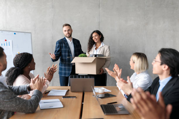 istock Manager Introducing New Female Colleague During Corporate Meeting In Office 1290490163