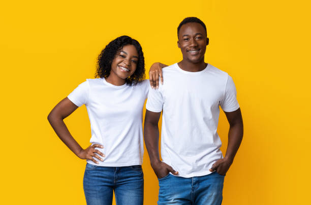istock Black guy and his girlfriend posing on yellow 1290490978