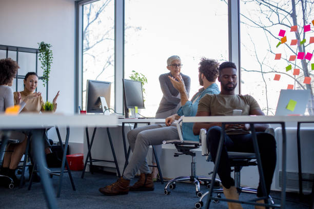 istock Group of freelancers in office. Working hour. 1290492292
