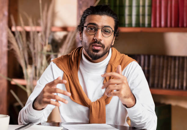istock Indian Teacher Talking To Camera Having Webinar Working From Home 1290493893