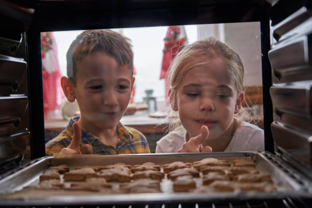 istock Baking Gingerbread Cookies in the Oven 1290493973