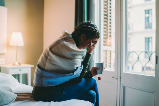 istock Woman staying home with flu virus 1290494179