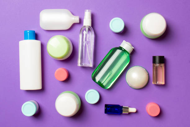 istock Group of plastic bodycare bottle Flat lay composition with cosmetic products on colored background empty space for you design. Set of White Cosmetic containers, top view with copy space 1290495002