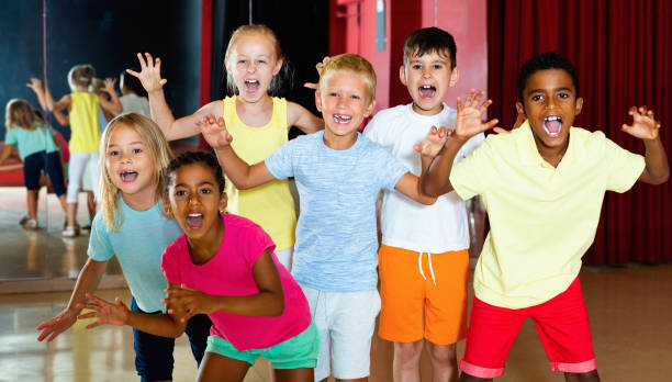 istock Happy emotional children posing at modern dance class 1290495071