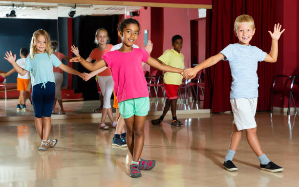 istock Friendly children trying dancing partner dance 1290495104
