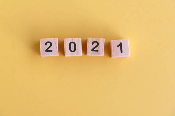 istock Number 2021 on wood block New Year concept 1290495438