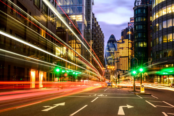 London rush hour light trails at dusk Personal viewpoint of light effects created by buses and cars speeding past camera as commuters travel through City of London financial district. green light stoplight photos stock pictures, royalty-free photos & images