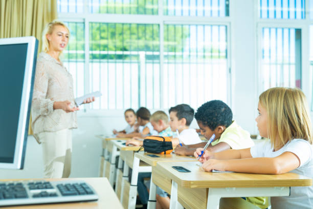 istock Side view of group of elementary school students 1290497099