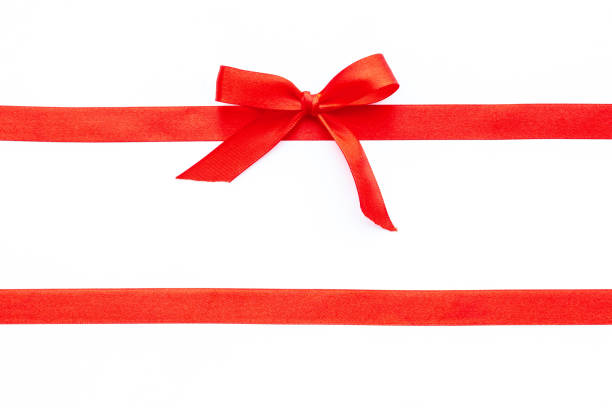istock Red ribbon with bow for holiday gift box or greeting card banner. Top view 1290497152