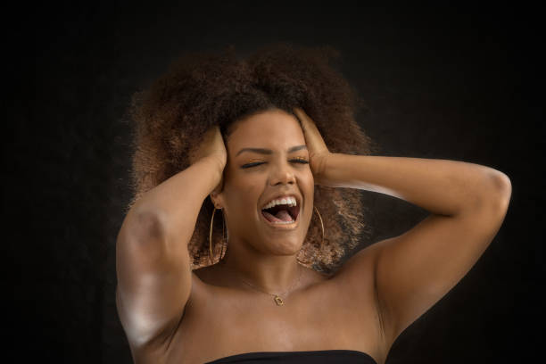 istock Black woman squeezing head and screaming in crisis 1290497372