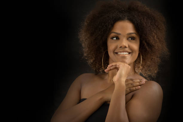 istock Dreamy tender black woman in studio 1290497407