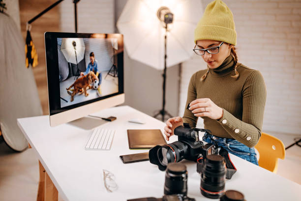 istock Woman looks at her pictures on the computer 1290498084