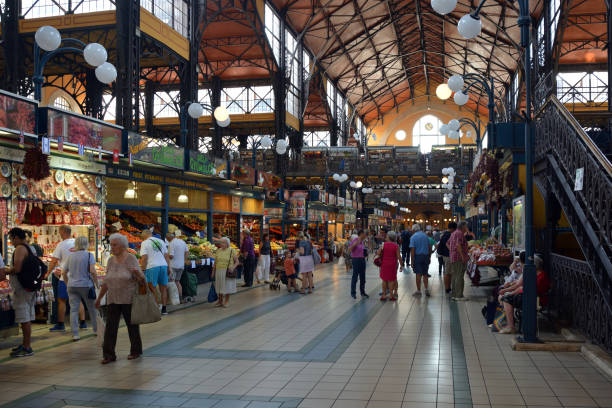 Central Market Hall in Budapest - Hungary. Central Market Hall in the Hungarian capital Budapest with visitors and customers shopping - Hungary. market hall stock pictures, royalty-free photos & images