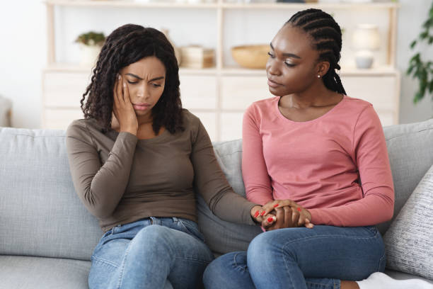 istock African american lady comforting her sick girlfriend 1290498435