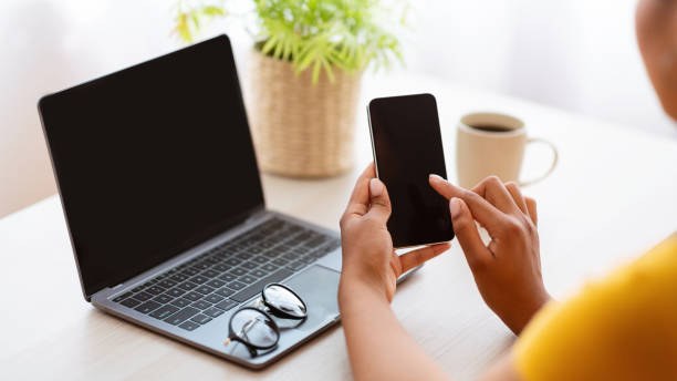 istock African American Woman Using Smartphone With Black Empty Screen 1290498696