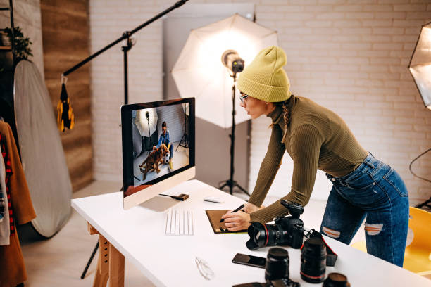 istock Woman looks at her pictures on the computer 1290498888