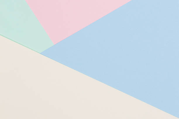 istock Abstract colored paper texture background. Geometric shapes and lines in light blue, pink, green, pastel yellow colors 1290500251