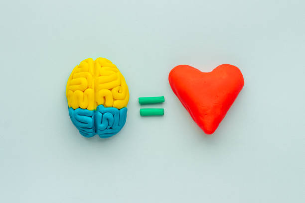 istock Think with love - heart and brain concept, top view 1290503176