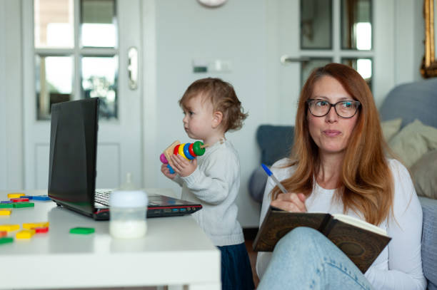 istock Mother and daughter home office. Lockdown concept. 1290504709