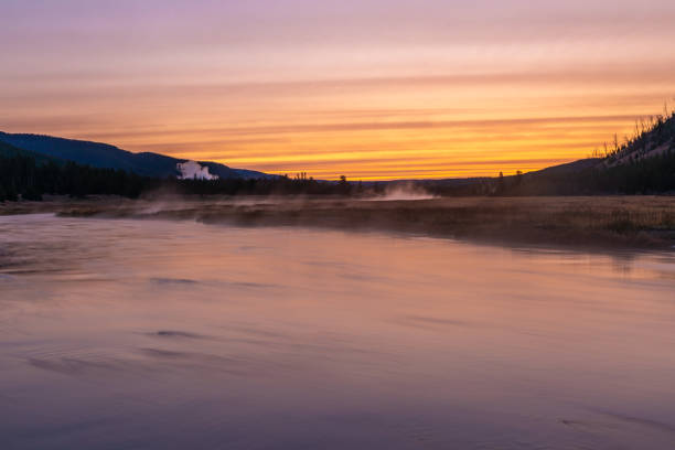 istock Dawn on Foggy Wyoming River 1290504897