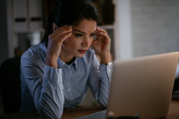 istock Businesswoman having headache 1290507874