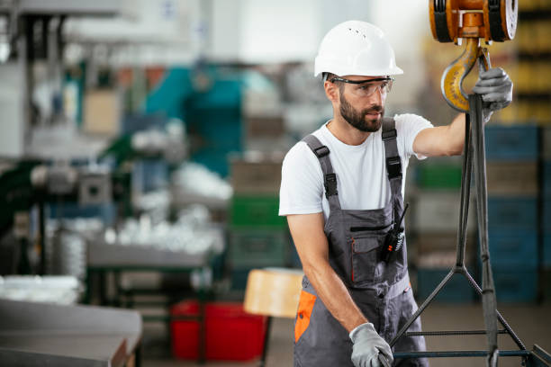 istock Young man with helmet working in the factory. 1290510798